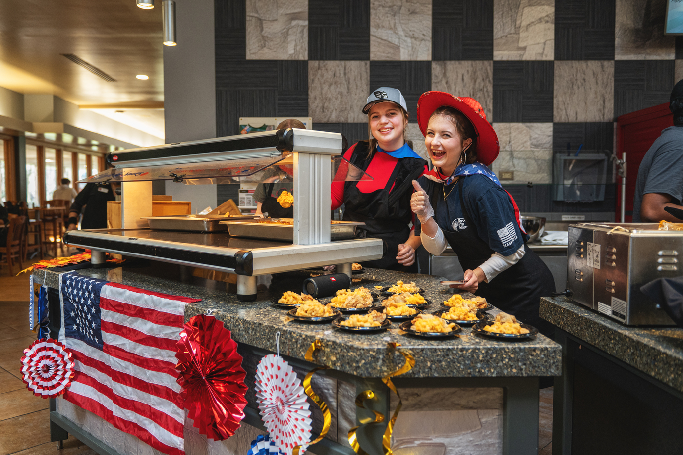 Two students serving food